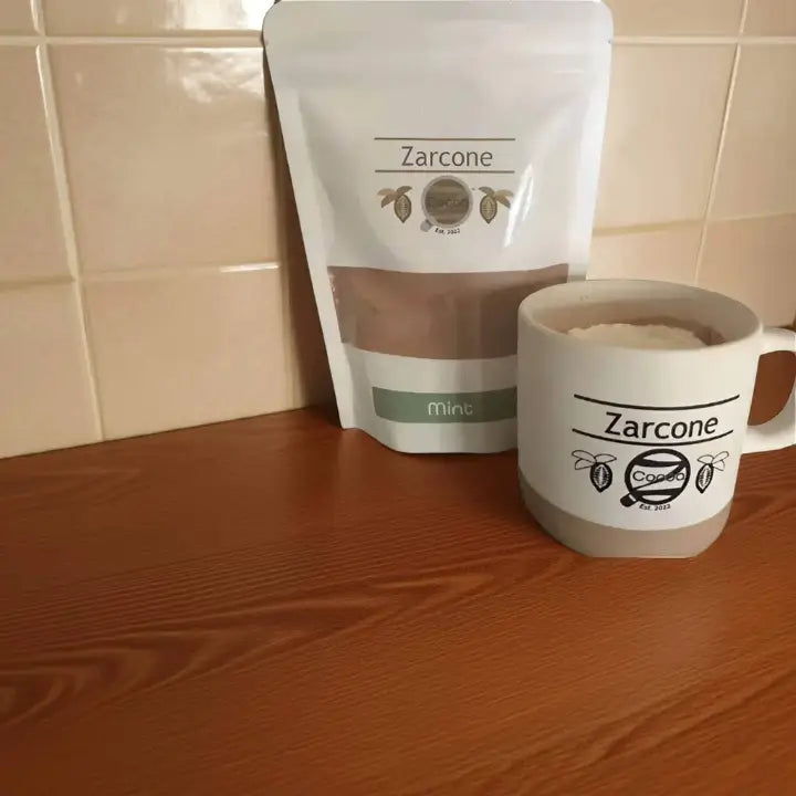 Zarcone branded mug and packaging on a wooden surface with tiled wall background