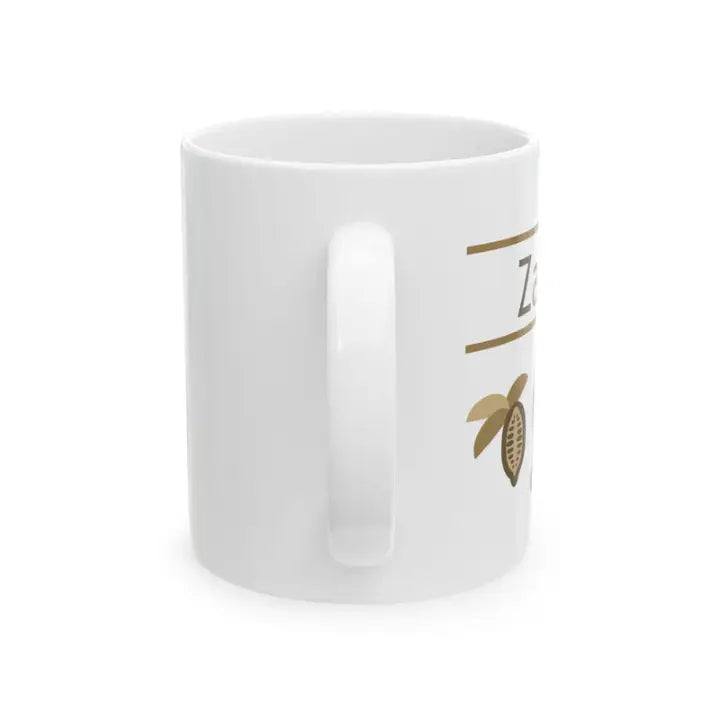 White mug with gold design on a white background