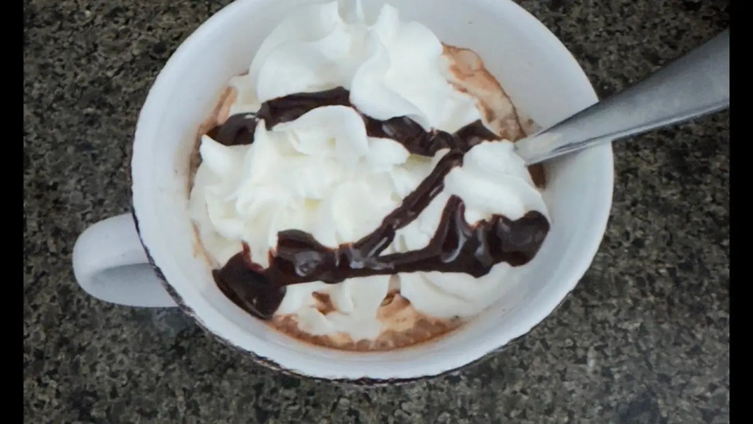 Hot Cocoa with Whipped Cream and Chocolate Drizzle